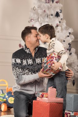 man gives his son New Year gift