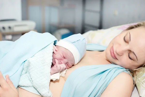 Young beautiful woman with a newborn — Stock Photo, Image