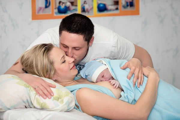 Young beautiful woman with a newborn — Stock Photo, Image