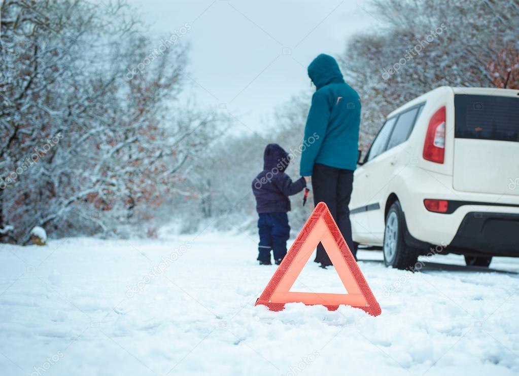 woman with a child on the winter road.