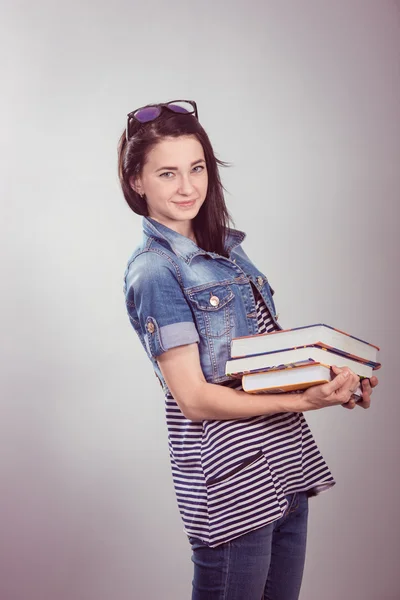 Young and beautiful student with books — Stock Photo, Image