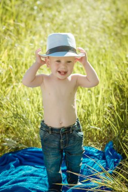 little boy on the lawn, a child for a walk outdoors