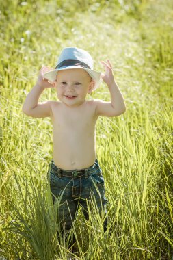 little boy on the lawn, a child for a walk outdoors