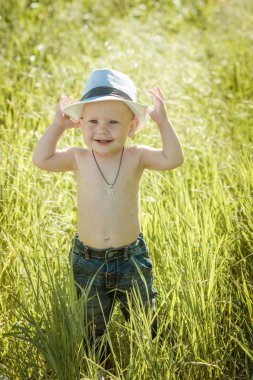 little boy on the lawn, a child for a walk outdoors