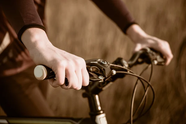 Cyclists riding on a dirt road — ストック写真