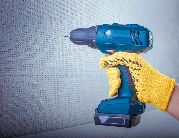 Electric screwdriver. Electric screwdriver in his hand — Stock Photo, Image