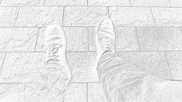 Monochrome white and gray image. Feet in boots against the background of street tiles or the road. Two legs of a seated person, photographed from above while sitting. Horizontal image. — Stock Photo, Image