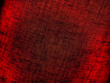 Kumaştan yapılmış kırmızı soyut arkaplan. Makro görüntü. Tap renginde çukurlar örüyorlar, siyah gölgeler ve vignettlerle. Noel için arka plan, Yeni Yıl, Sevgililer Günü