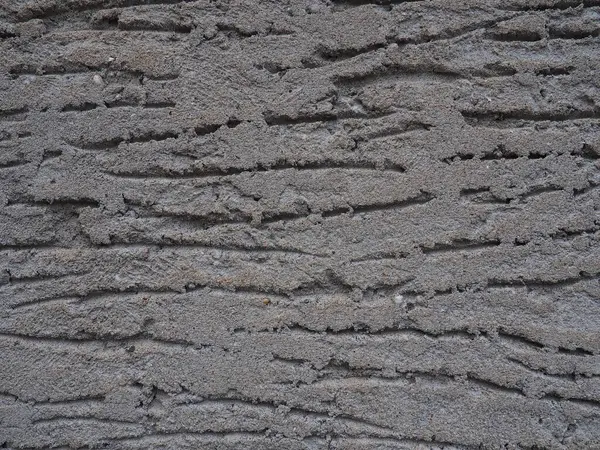 壁にコンクリートや石膏の質感 壁に穴が開いてる 石膏の中の波線 コンクリートや石膏の質感 グレー — ストック写真