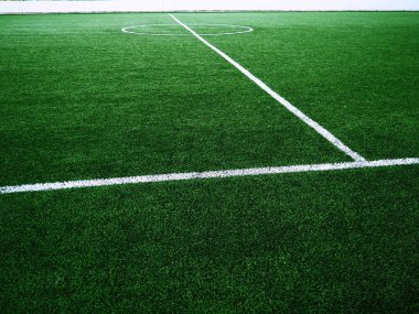 The marking of the football field on the green grass. White lines no more than 12 cm or 5 inches wide. Football field area clipart