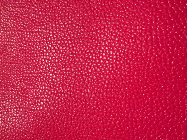 Kırmızı ya da pembe deri. Moda aksesuarları, deri ve süet ürünleri, mobilya döşemeleri için malzeme. Doğal deri dokusu. Magenta ya da fuşya