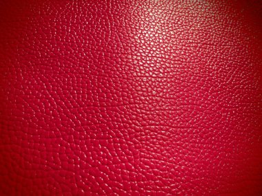 Kırmızı ya da pembe deri. Moda aksesuarları, deri ve süet ürünleri, mobilya döşemeleri için malzeme. Doğal deri dokusu. Magenta ya da fuşya.