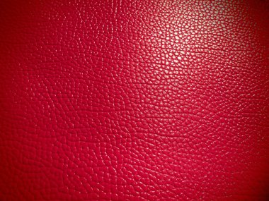 Kırmızı ya da pembe deri. Moda aksesuarları, deri ve süet ürünleri, mobilya döşemeleri için malzeme. Doğal deri dokusu. Magenta ya da fuşya.