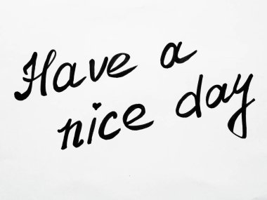 Have a nice day. Phrase or lettering. Black handwritten words. White background. Good day wishes or goodbye greetings. Postcard.
