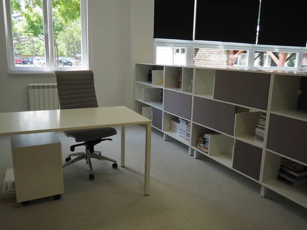 Sremska Mitrovica, Serbia, May 15, 2021 Interior of the school library. Modern school equipment. Equipment of the school and the learning process. Bookshelves. Blackout curtains and blinds on windows