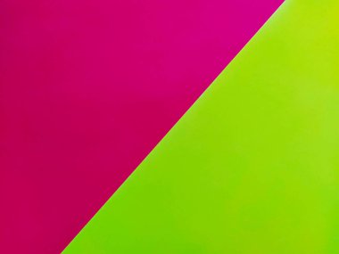 Sarı-pembe parlak arka plan. Çapraz konulmuş renkli kağıtlar. Eğim ve aydınlatma fişeği var..