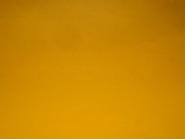 yellow vivid abstract background. A beautiful rich yellow color close to ocher