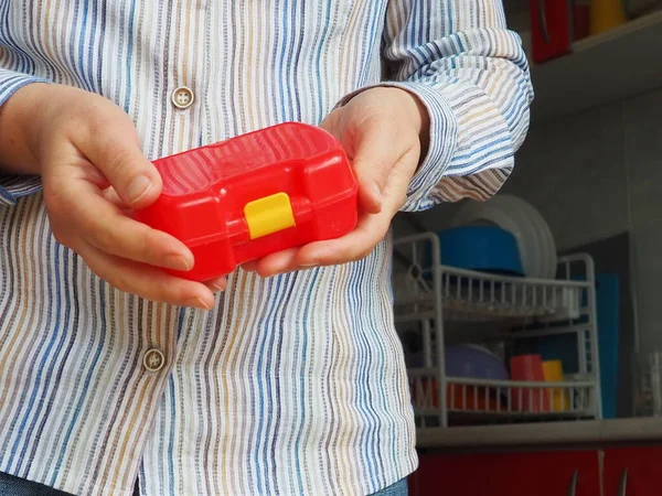 Female Hands Hold Red Closed Plastic School Lunch Container Packaging — Stock Photo, Image