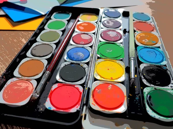 A set of watercolors of different colors for drawing. Multicolored round containers with bright paint. Tools for the lesson of drawing and labor. Colored paper. Red, blue, yellow, green colors