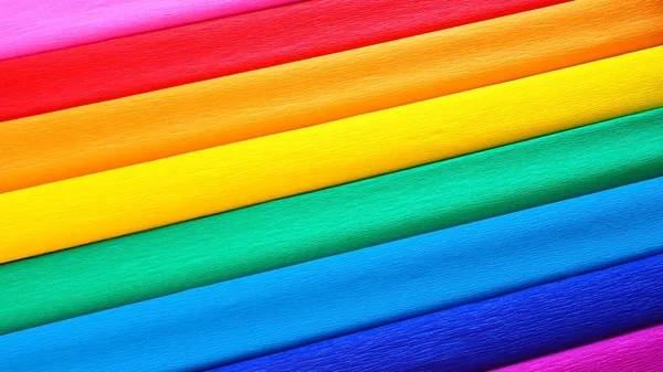 Pride Flag by Gilbert Baker. Symbol of the overall LGBTQ LGBTI community. Crepe paper is available in pink, red, orange, yellow, crepe, blue, purple and magenta. Colorful background for Pride events — Stock Photo, Image