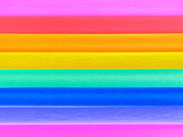 Bandeira do orgulho por Gilbert Baker. Símbolo da comunidade LGBT LGBTI em geral. O papel crepe está disponível em rosa, vermelho, laranja, amarelo, crepe, azul, roxo e magenta. Fundo colorido para eventos Pride — Fotografia de Stock