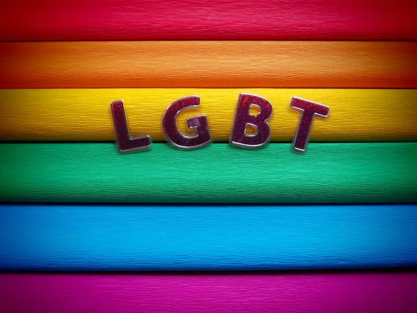 Abreviatura LGBT, texto da carta. Letras LGBT roxas no fundo da bandeira do arco-íris. Uma vinheta escura. Uma bandeira do arco-íris, a bandeira do orgulho. Símbolo da comunidade LGBTQ. — Fotografia de Stock