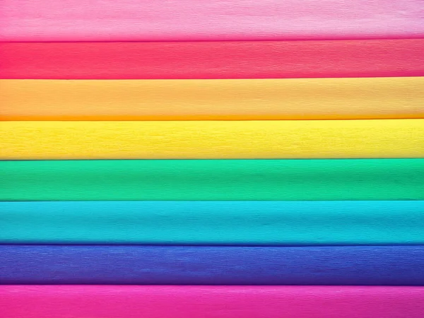 Pride Flag by Gilbert Baker. Symbol of the overall LGBTQ LGBTI community. Crepe paper is available in pink, red, orange, yellow, crepe, blue, purple and magenta. Colorful background for Pride events — Stock Photo, Image