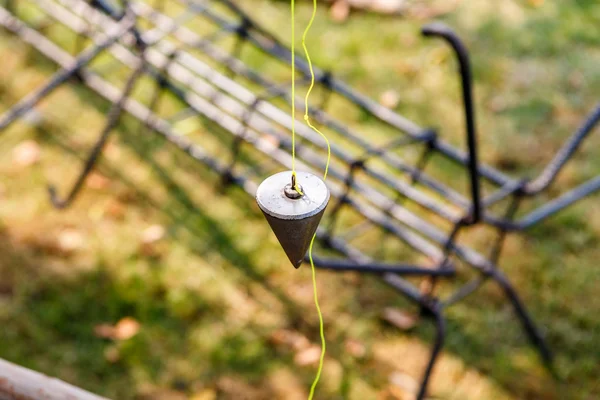 Plumb bob for construction job — Stock Photo, Image