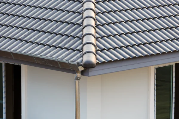 Gutter on the roof top of house — Stock Photo, Image