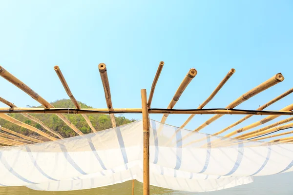 Wooden with fabric roof on blue sky — Stock Photo, Image