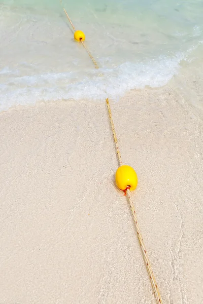 Yellow buoy on the beach — Stock Photo, Image