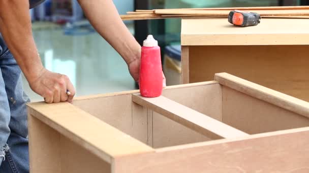 Carpenter used air-gun for make new furniture — Stock Video