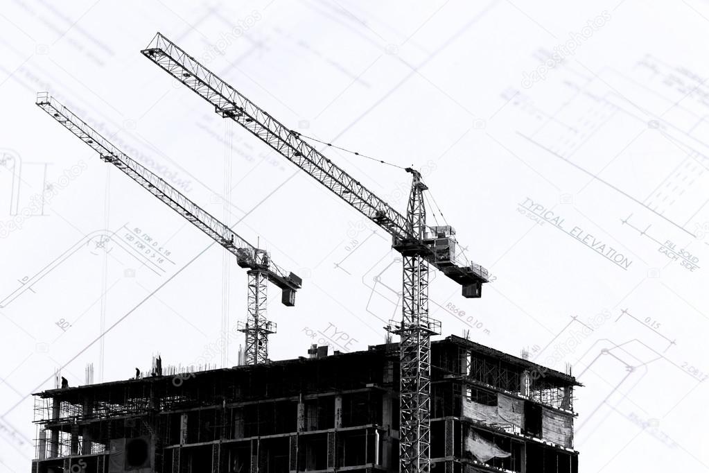 Construction site with cranes on silhouette background 
