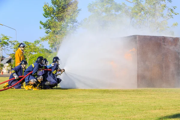 Firefighter fighting for fire attack training — Stock Photo, Image