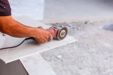 Labor cutting tile floor clipart
