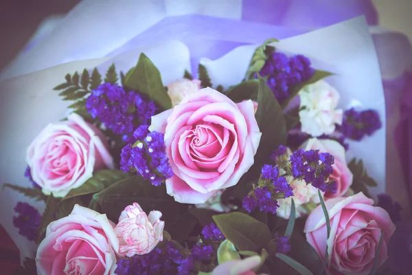 Pink rose with purple bouquet — Stock Photo, Image