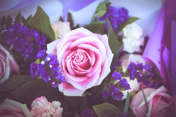 Pink rose with purple bouquet — Stock Photo, Image