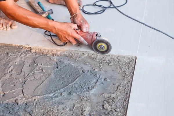 Labor installing tile floor — Stock Photo, Image