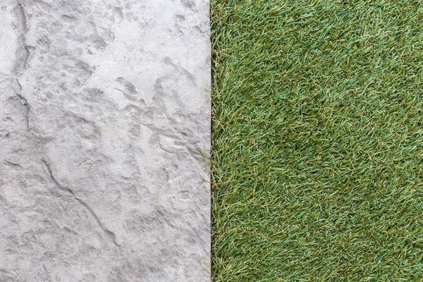 Artificial grass with stone floor texture backgroud — Stock Photo, Image