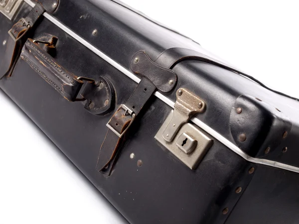 Une vieille valise en cuir vintage noir avec sangles et serrures Images De Stock Libres De Droits