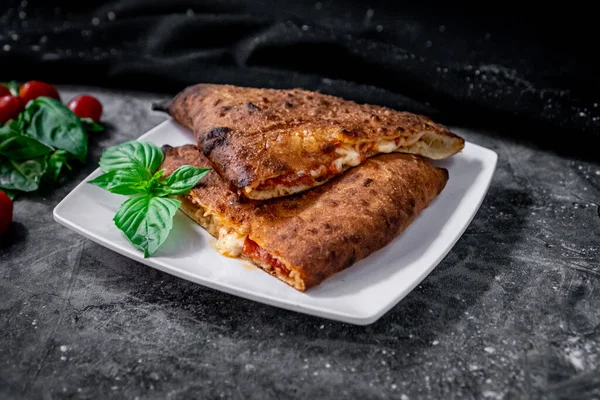 Exquisite Calzone Tomato Sauce Pepperoni Served White Plate Tomatoes Baby — Stockfoto