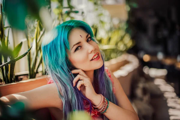 Portrait of a blue-haired girl in a cafe Stock Picture