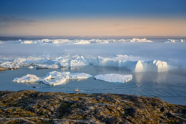 Two fishing boats float between glaciers in a fjord while whaling — Stock Photo, Image