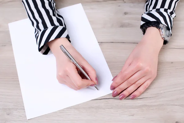 Businessman writing or drawing a note in a blank notebook — Stock Photo, Image