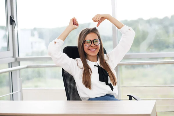Portrait of attractive business woman in office, shirt and business clothes
