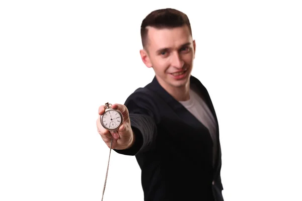 Handsome businessman holding a clock. Over white background — Stock Photo, Image