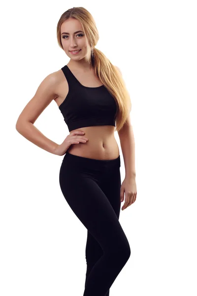 Porträtt av sexiga unga kvinnan tittar på kameran. Fitness kvinnliga w — Stockfoto