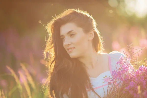 Happy young girl smiling, holding hands in lavender. Soft focus, — Stock Photo, Image