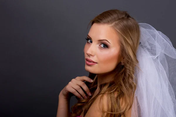 Portrait of beautiful female model on blue background — Stok Foto