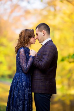 wedding couple hugging, the bride holding a bouquet of flowers i